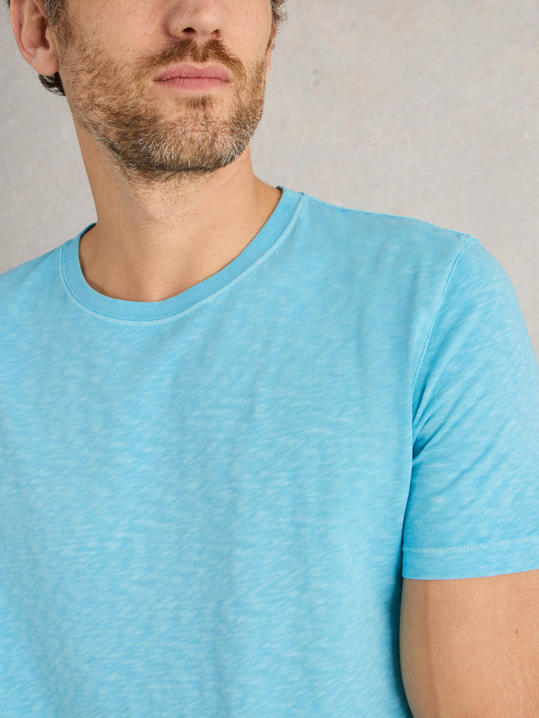 Light blue short-sleeved crew neck t-shirt with a textured, slightly heathered appearance.
