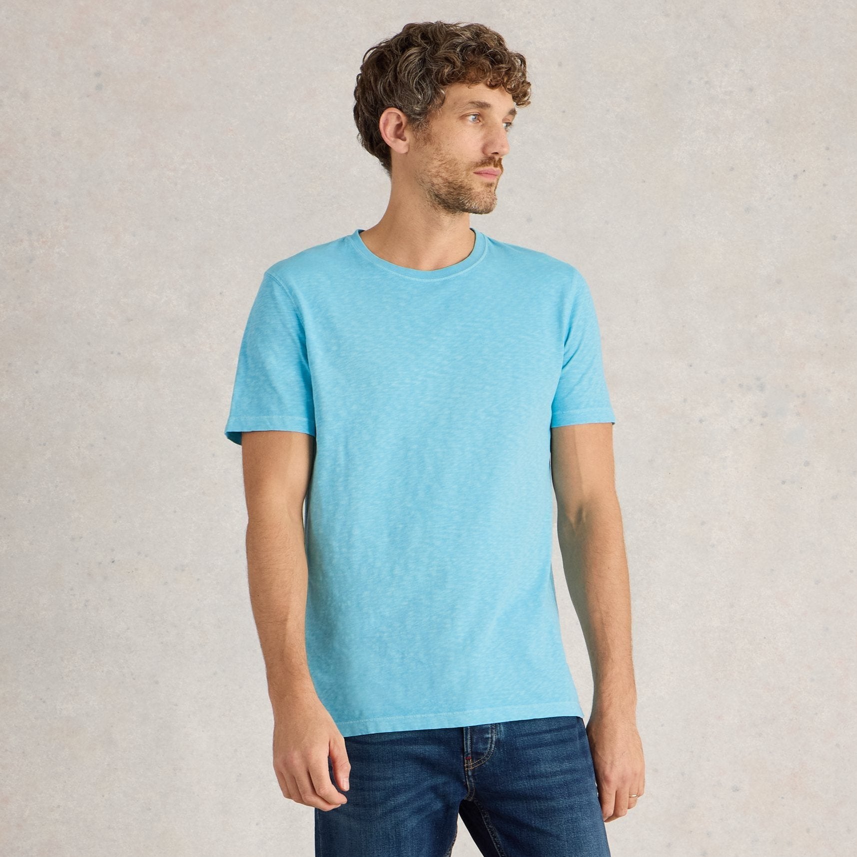 Light blue, short-sleeved crew neck t-shirt with a slightly textured appearance.