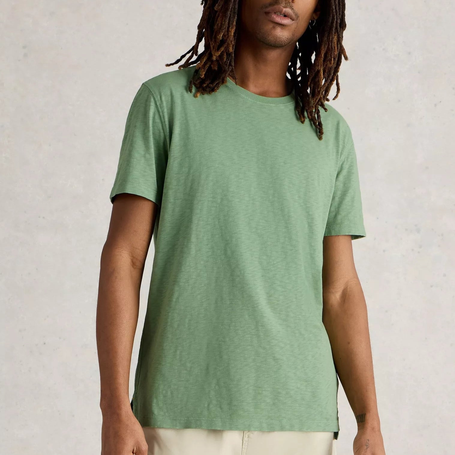 Sage green crew neck short-sleeve t-shirt, lightweight fabric with subtle texture.