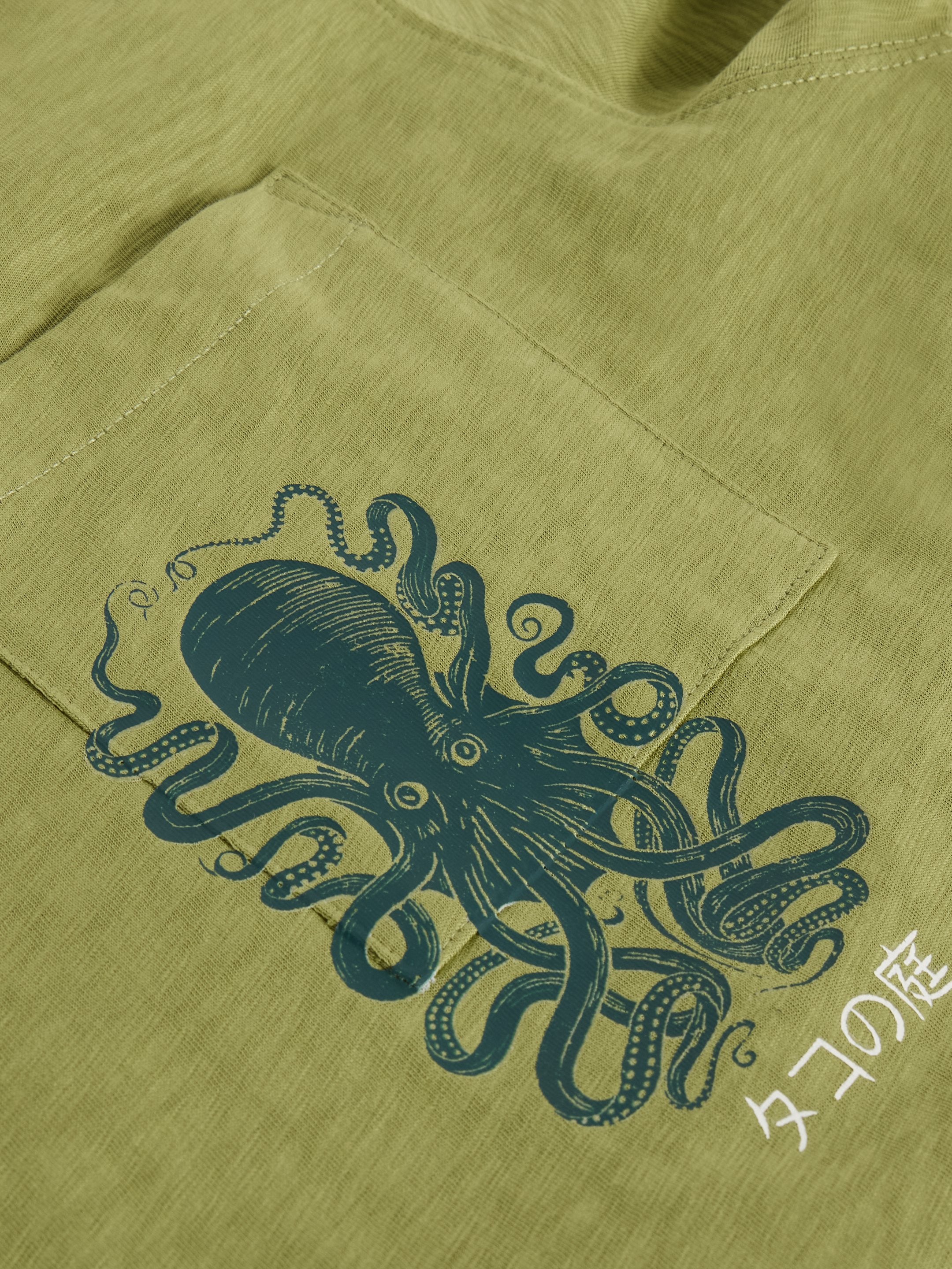 Olive green t-shirt with a dark teal octopus graphic on the pocket. The octopus is detailed and stylized.
