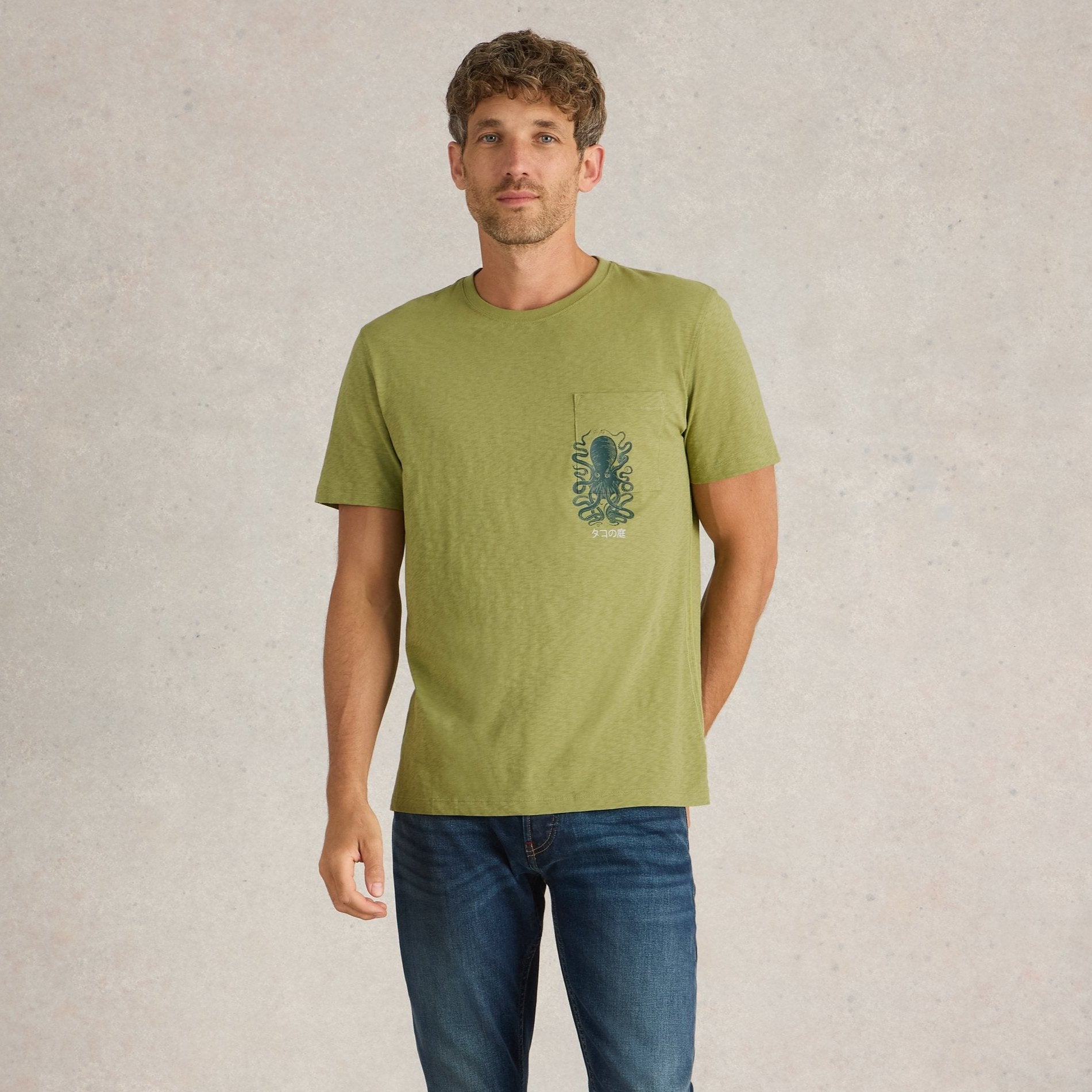 Olive green short-sleeve t-shirt with a small pocket featuring an octopus graphic and Japanese text.