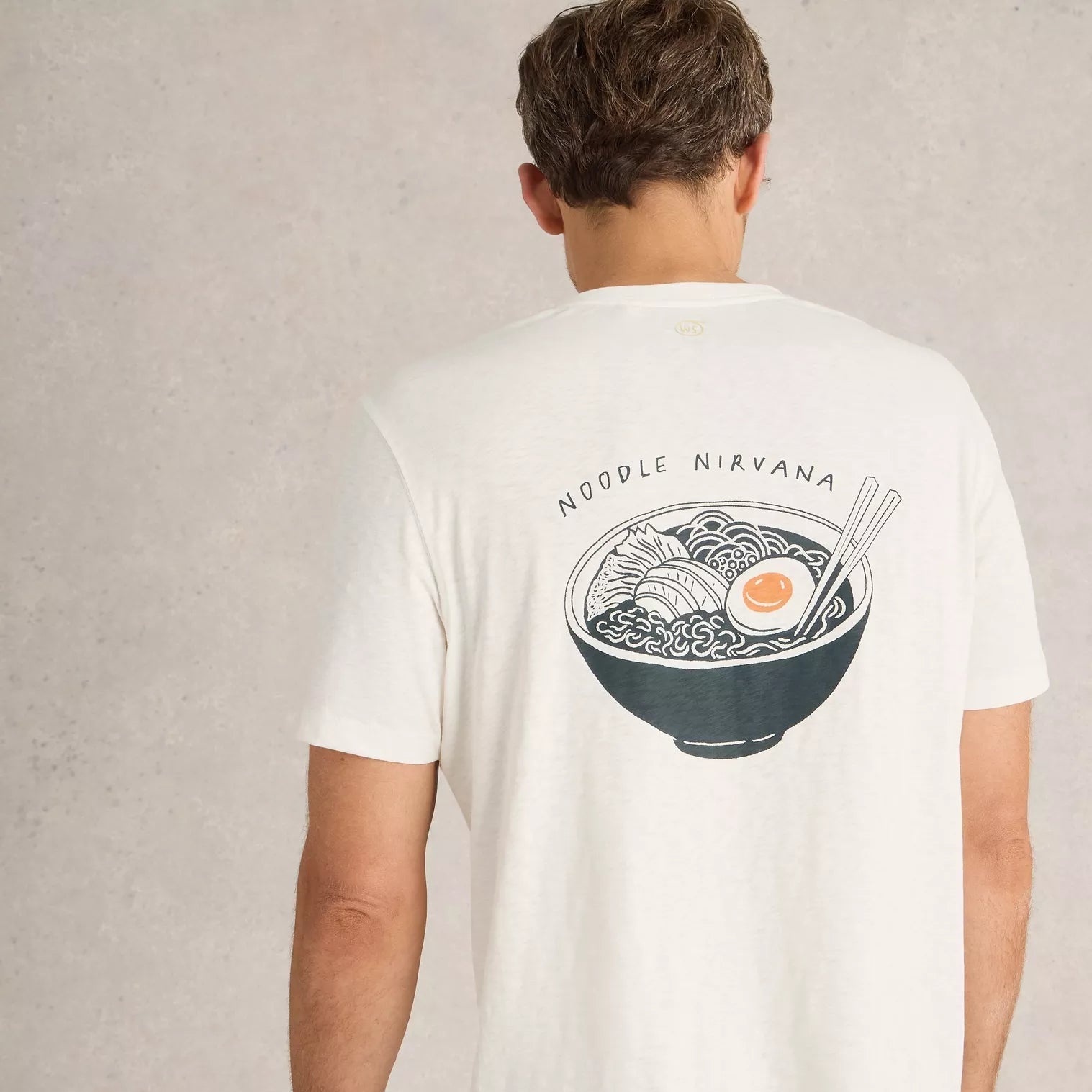Off-white t-shirt featuring a back graphic of a bowl of ramen noodles with an egg and chopsticks; text above reads "Noodle