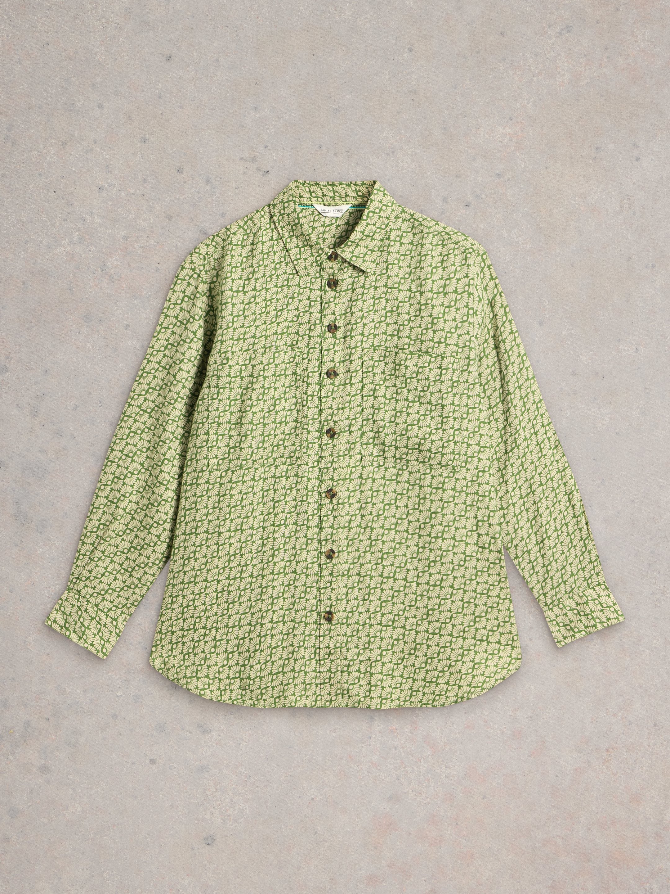 Green long-sleeved button-down shirt with a cream floral pattern.
