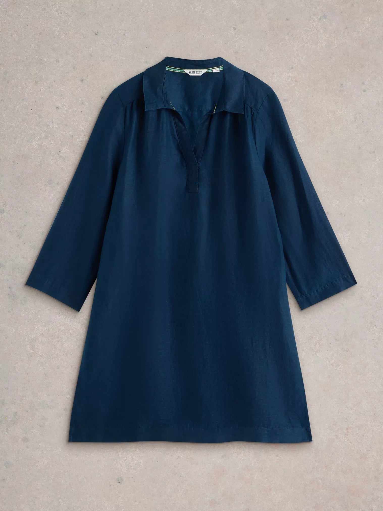 Dark blue linen tunic with three-quarter sleeves and a collared V-neck.
