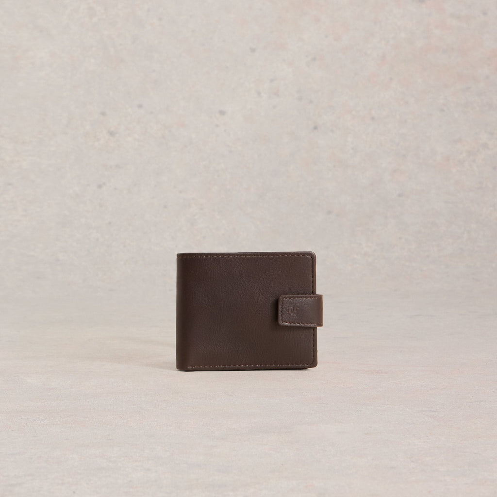 Brown leather wallet on a light beige textured background