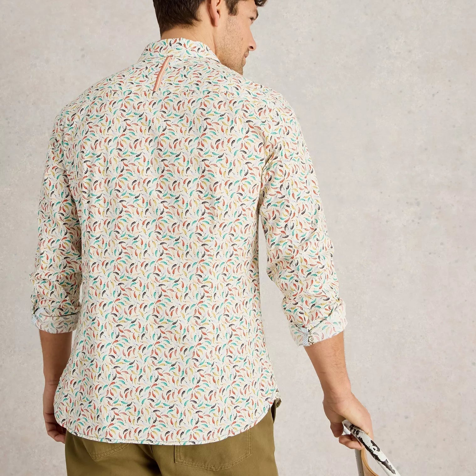Men's long-sleeve button-down shirt in off-white with an all-over chili pepper print in teal, orange, and red.