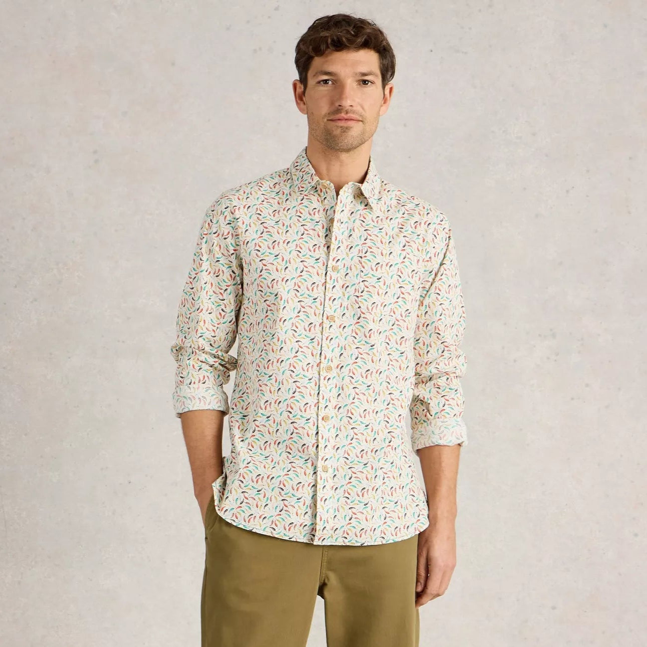 Men's off-white long-sleeve shirt with a multicolored small-scale leaf print.