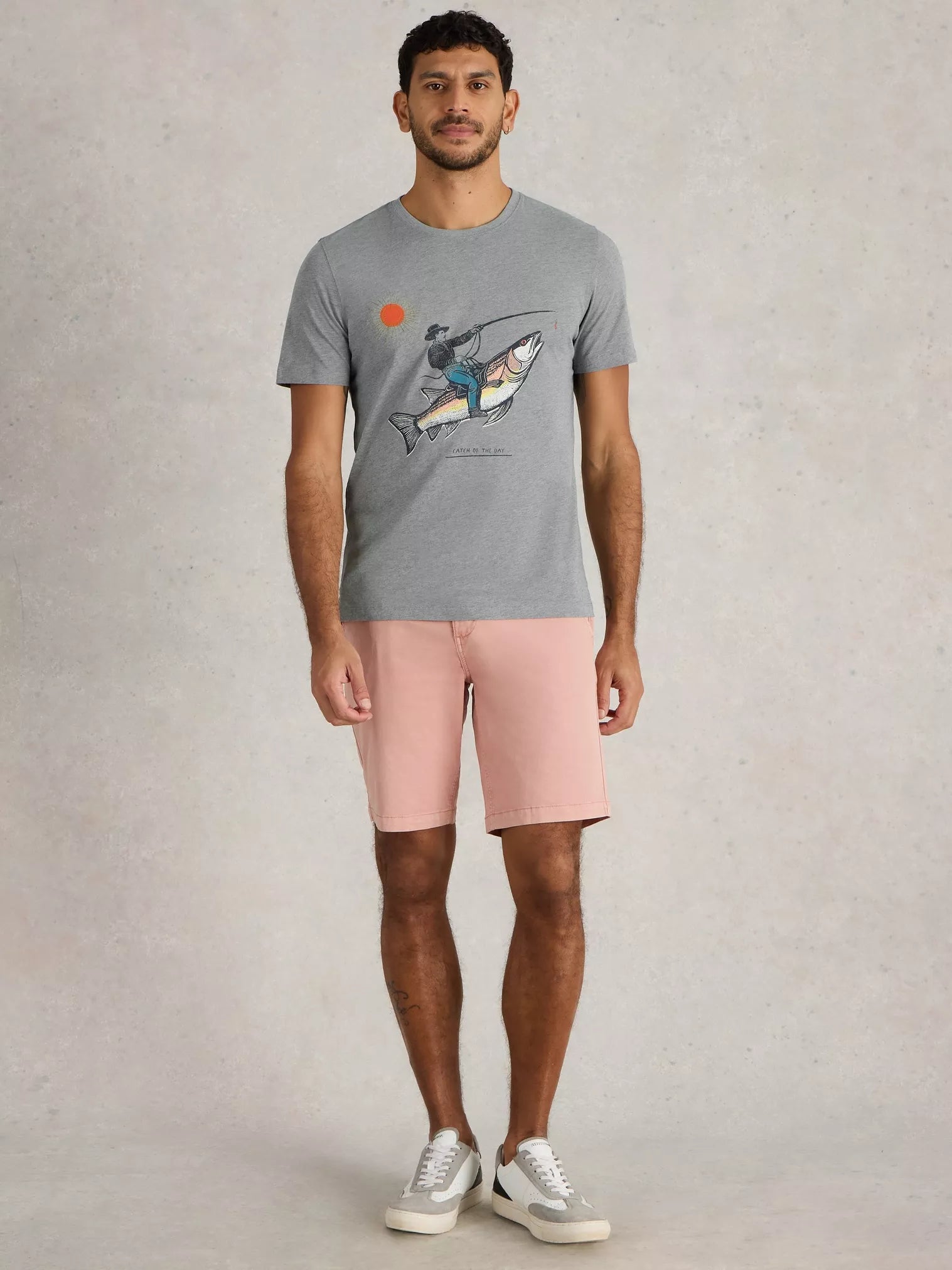 Gray crew-neck t-shirt featuring a graphic illustration of a person fishing from a large fish under a sun.