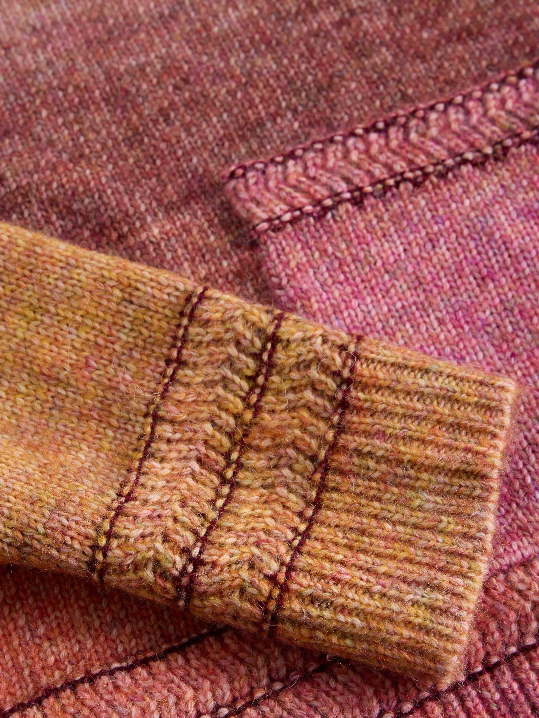 Close-up of a textured fabric with stitching detail