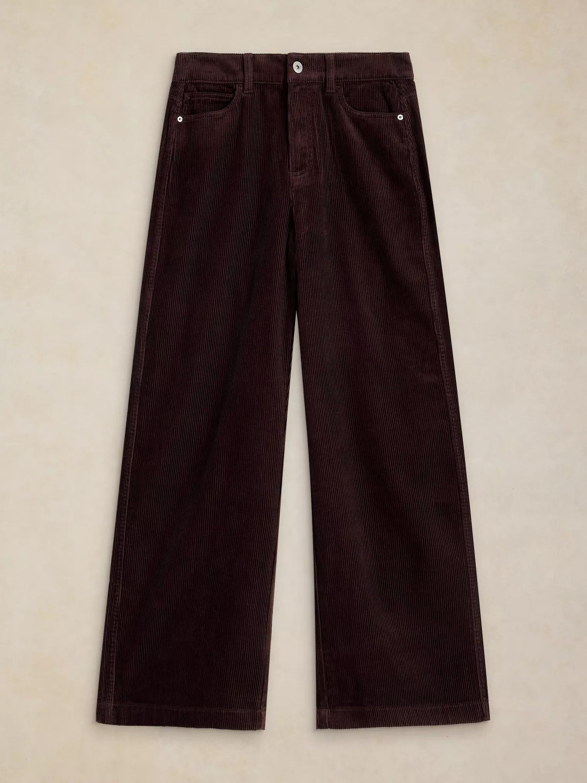 Dark brown corduroy wide-leg pants laid flat on a textured beige background.