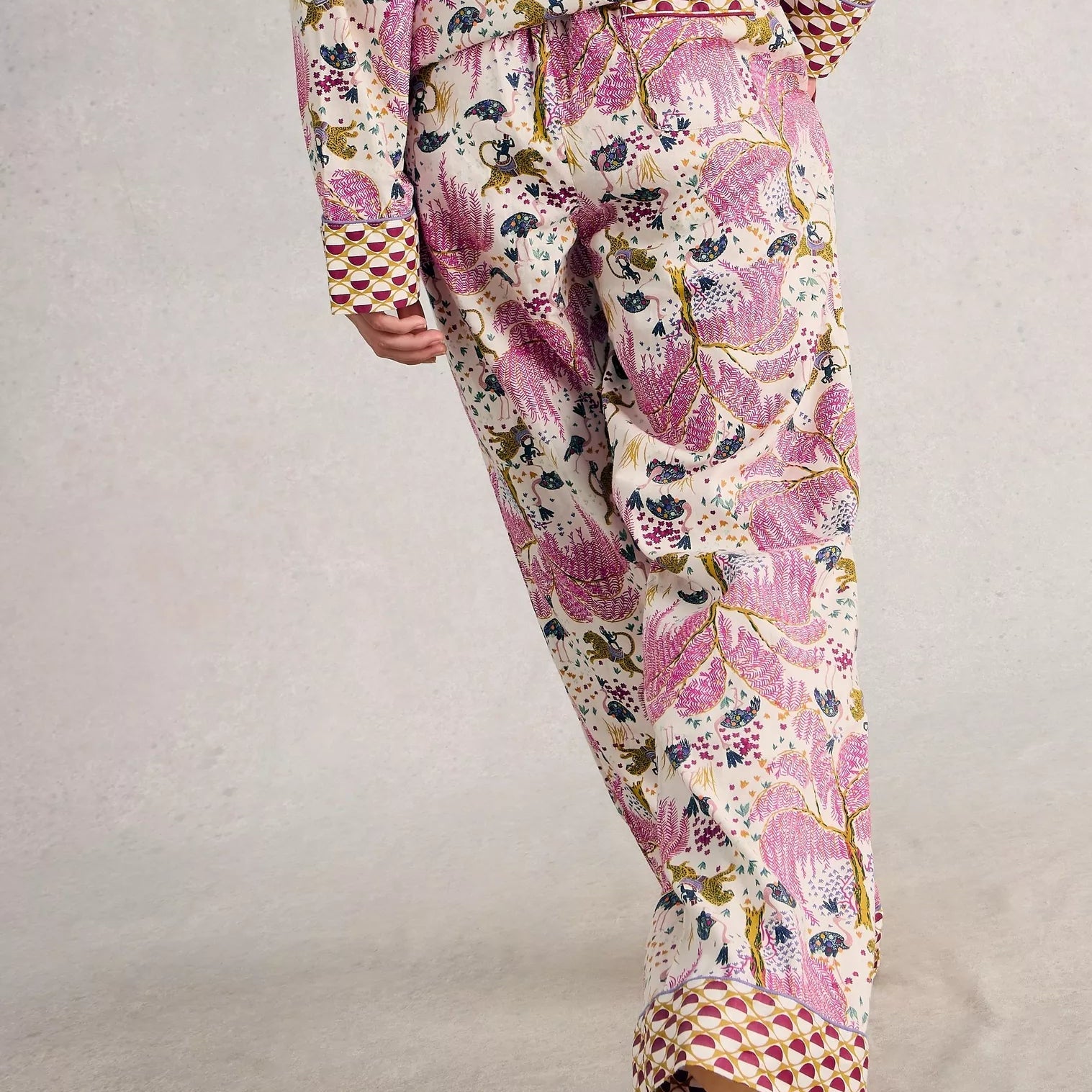 Floral patterned pajama set on a plain background