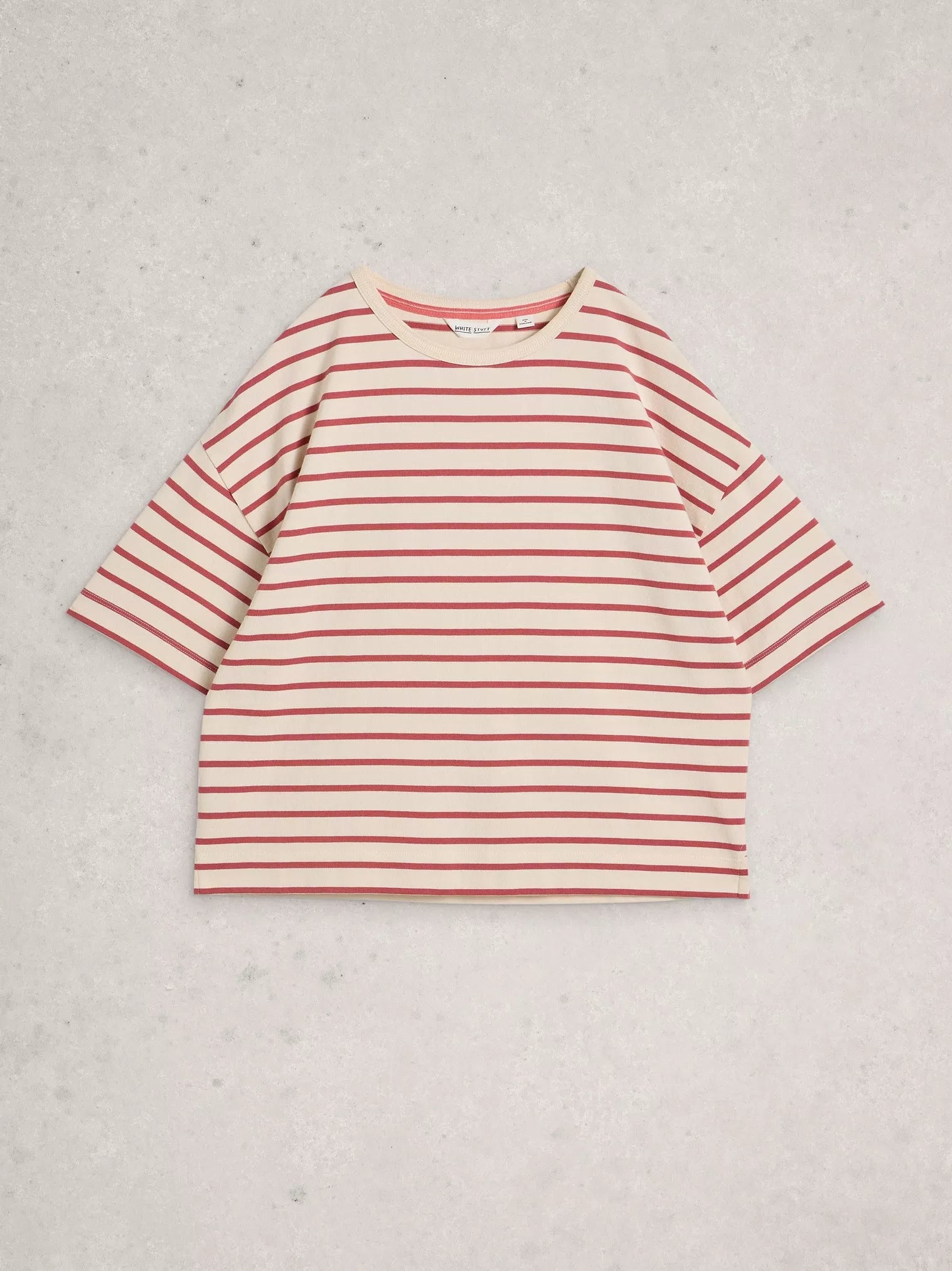 Red and white striped shirt on a light gray background