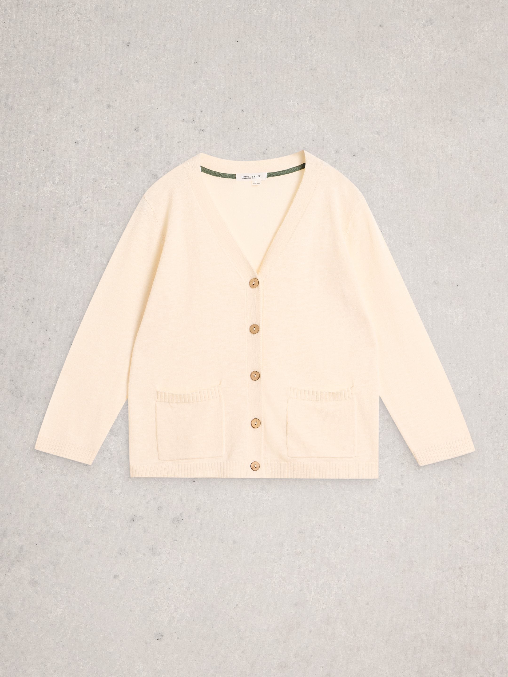 Beige cardigan on a light gray background