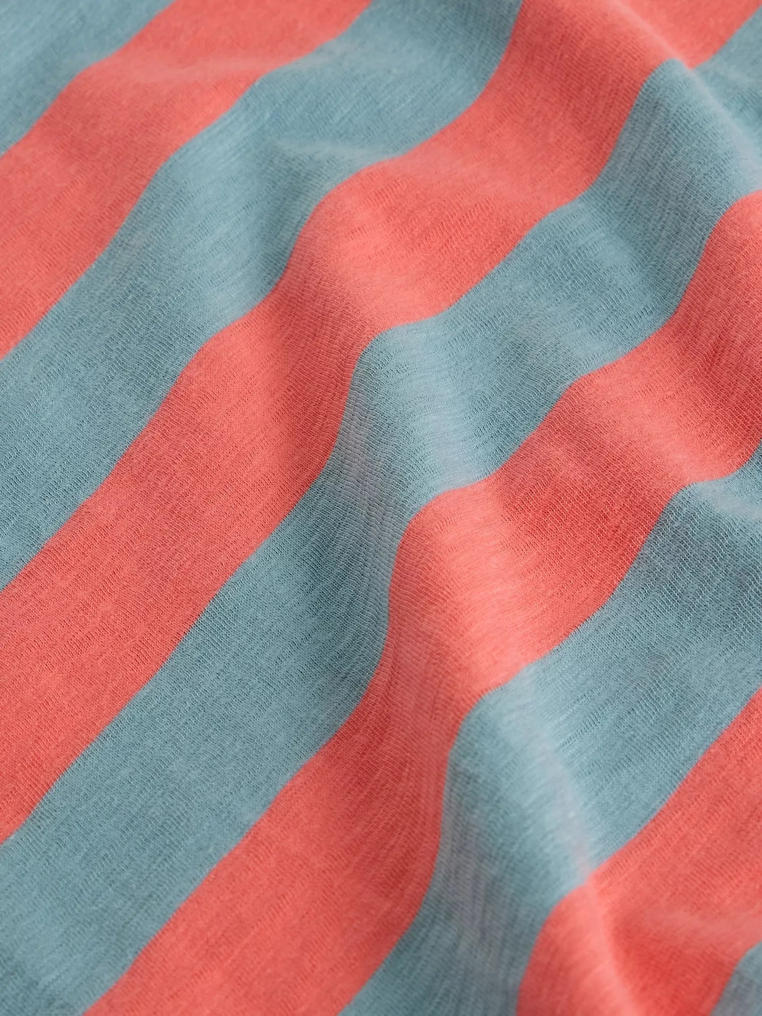 Close-up of fabric with red and blue horizontal stripes
