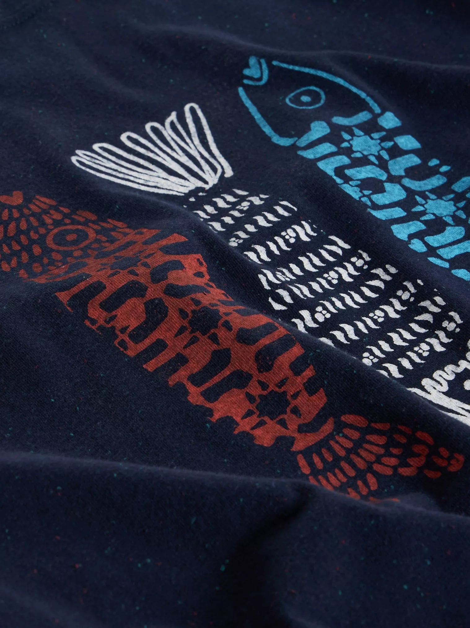 Navy blue fabric with multicolored fish pattern