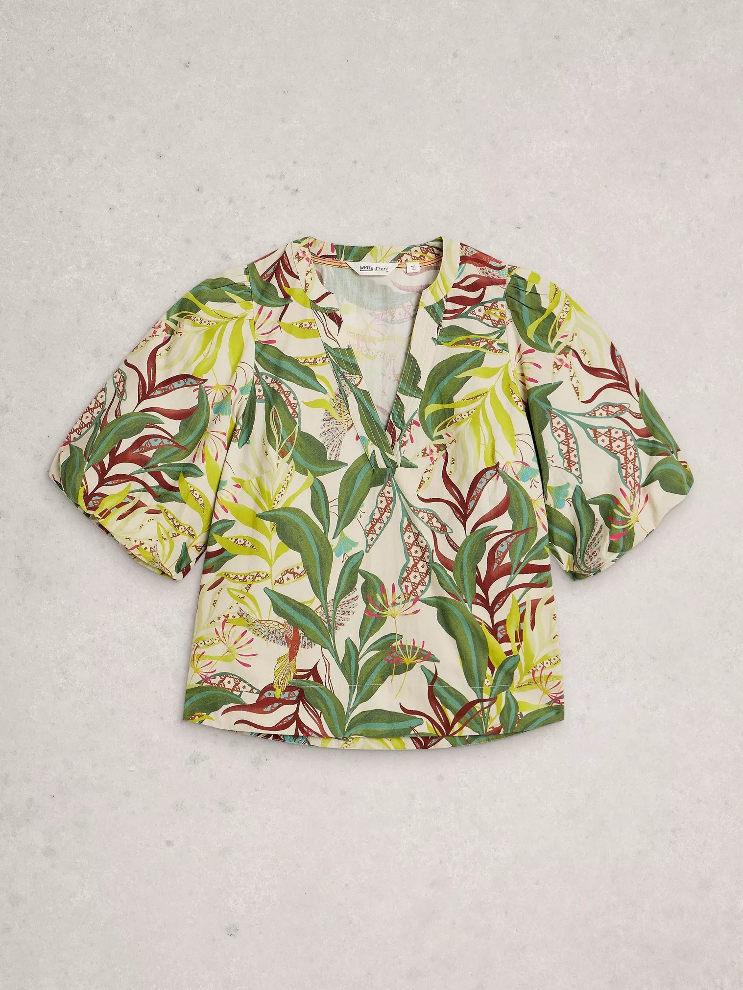 Floral patterned blouse on a light gray background