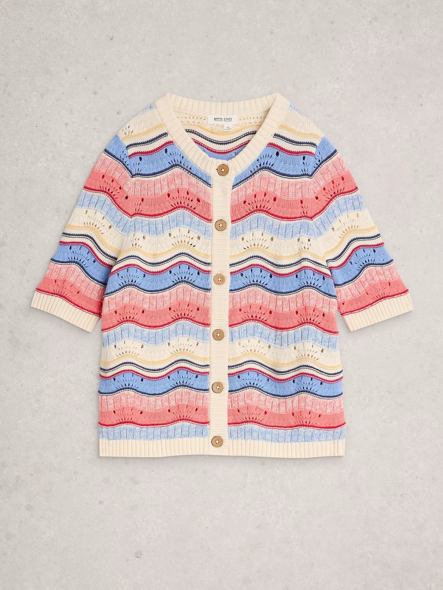 Colorful striped cardigan on a gray background