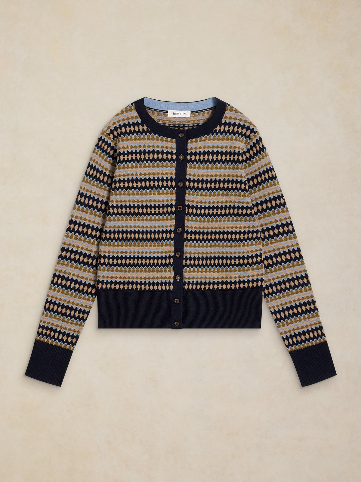 Patterned cardigan on a beige background