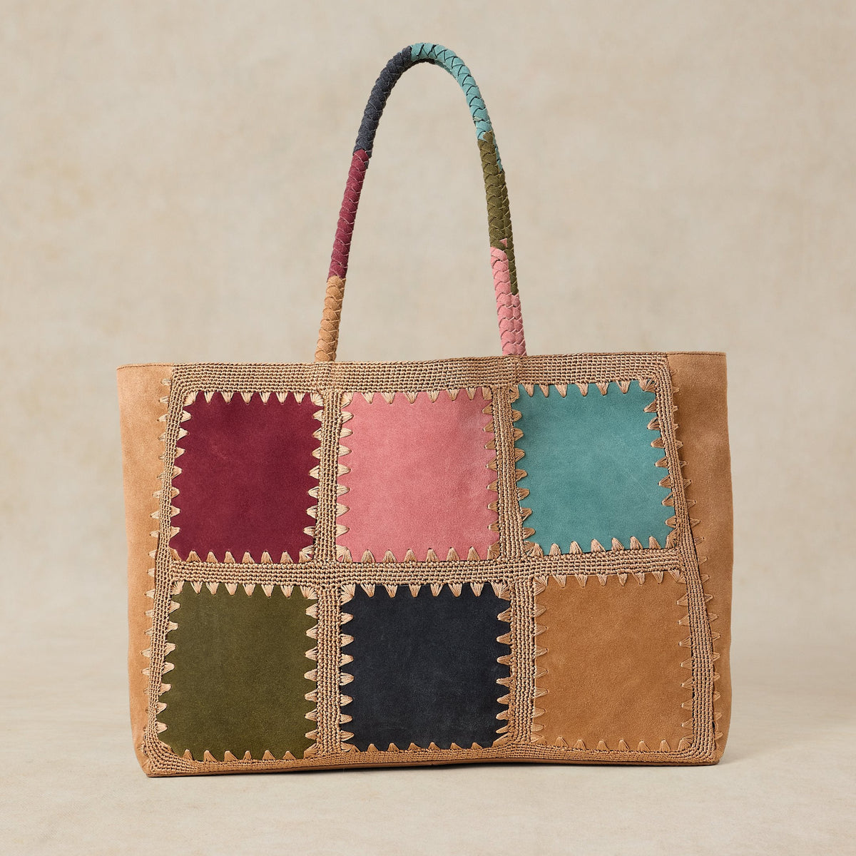 Multicolored patchwork tote bag with a beige background