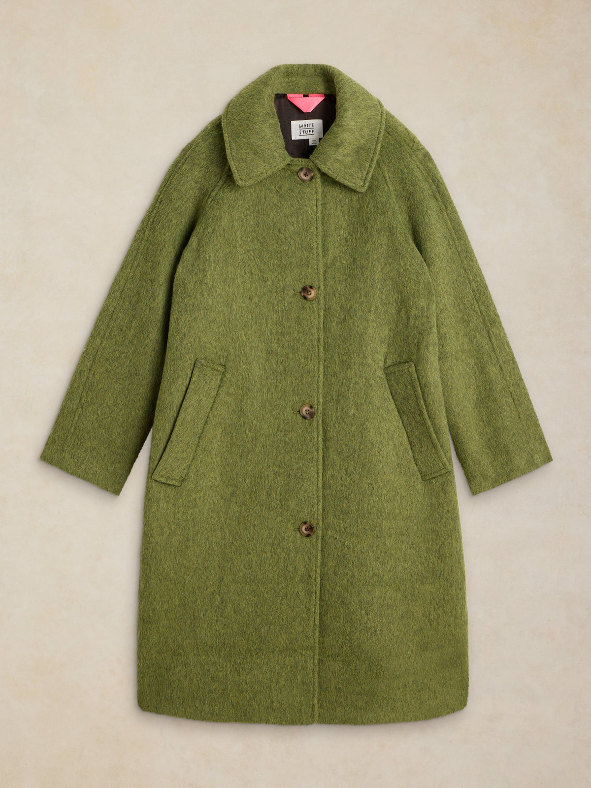 An olive green wool-blend coat with a wide collar, front buttons, and large front patch pockets, shown flat against a light beige textured background.
