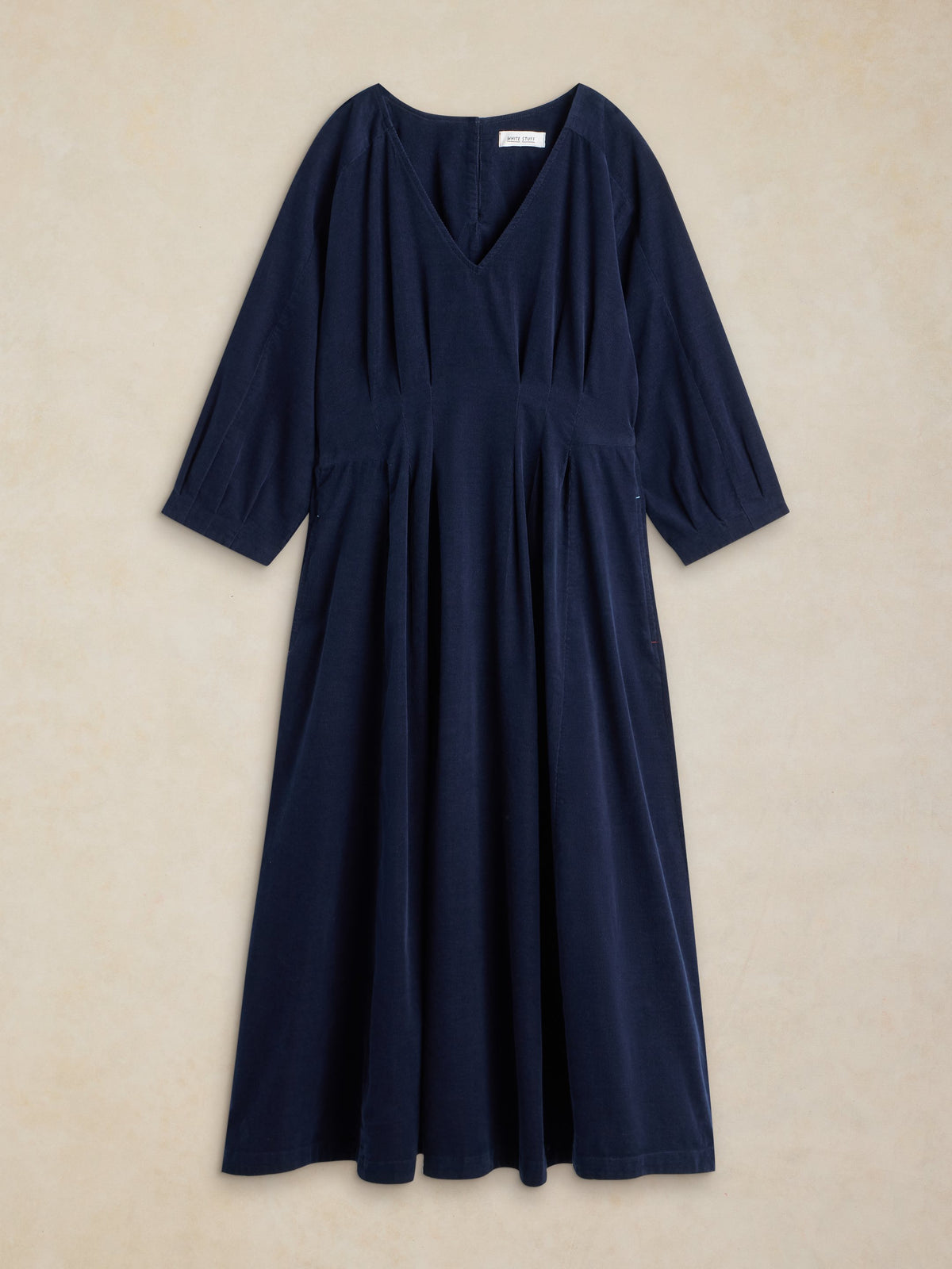 Navy blue dress displayed on a plain background