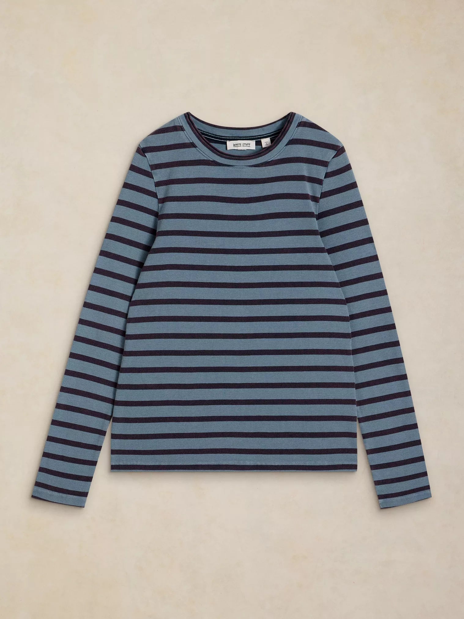 A long-sleeve crewneck knit top with horizontal stripes in slate blue and dark navy, laid flat on a textured beige background.