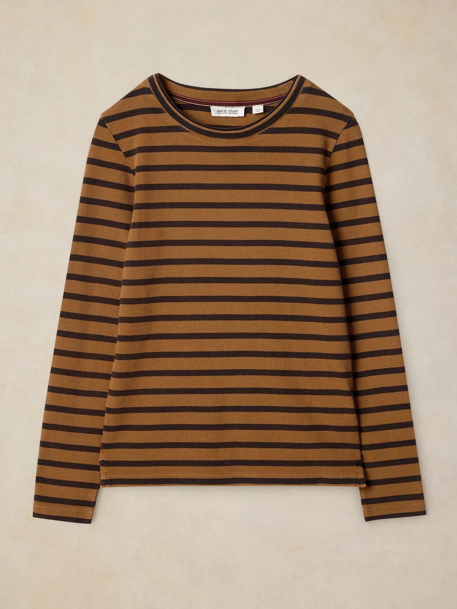A long-sleeve crewneck knit top with horizontal stripes in warm brown and dark brown, laid flat against a textured beige background.