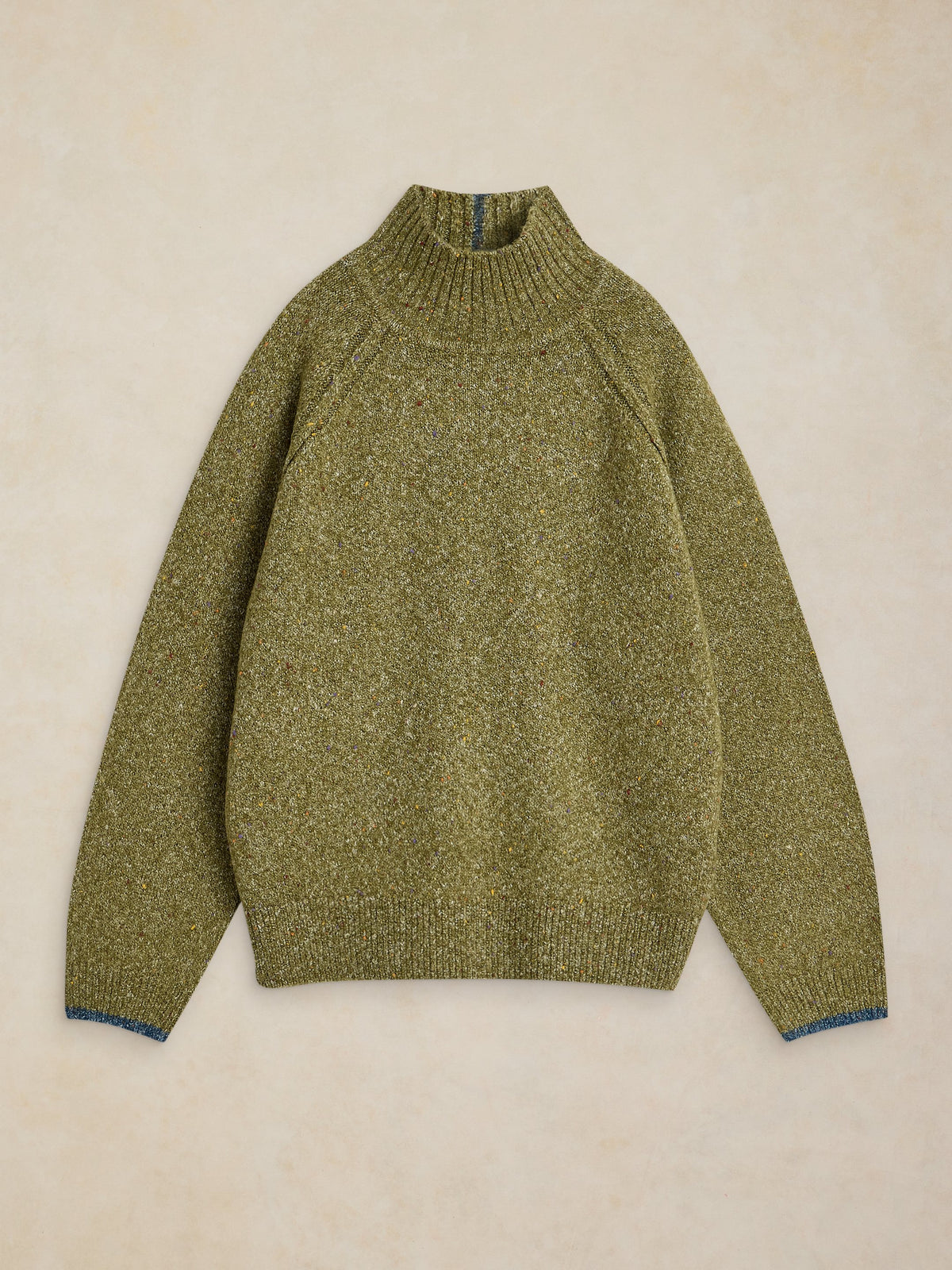 An olive green knit mock neck sweater with a subtle heathered texture, laid flat on a light beige textured background.