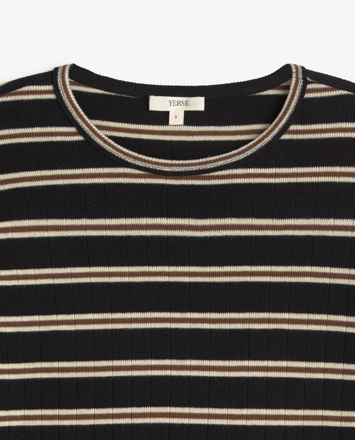 Close-up of a ribbed knit top with horizontal black, beige, and white stripes, featuring a cream neck label that reads YEISE.