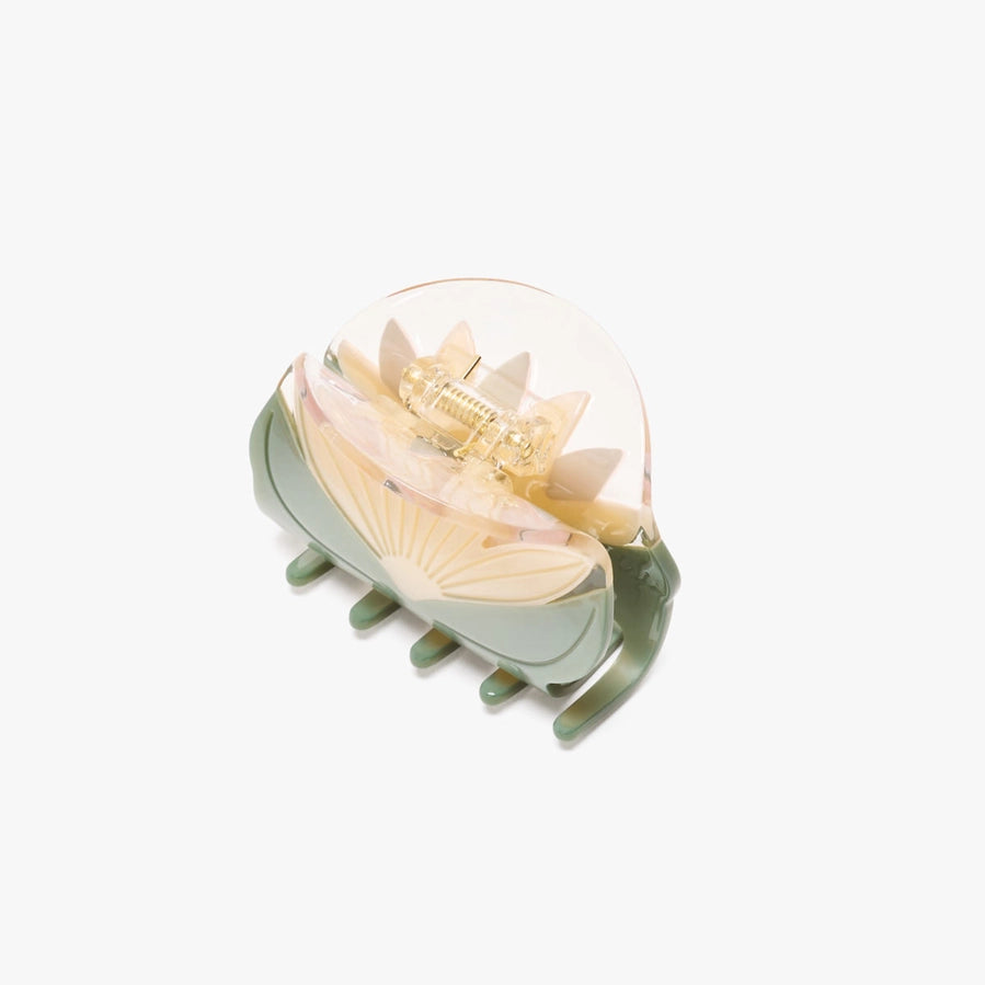 Decorative hair clip with floral design on a white background