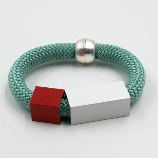 Mint green rope bracelet with red and white rectangular accents and a silver magnetic clasp.