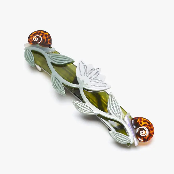 Decorative hair barrette with leaf design and tortoiseshell accents on a white background