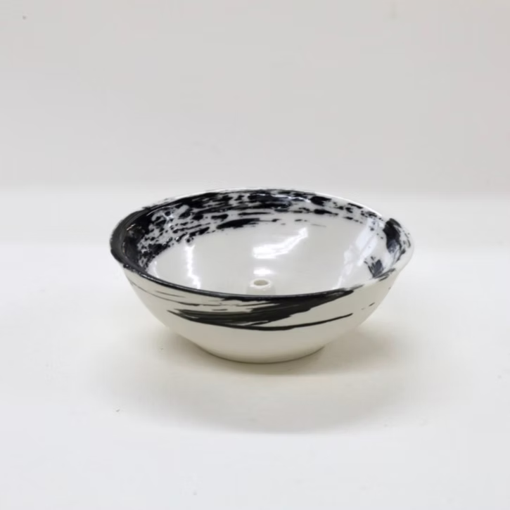 Black and white ceramic bowl on a white background