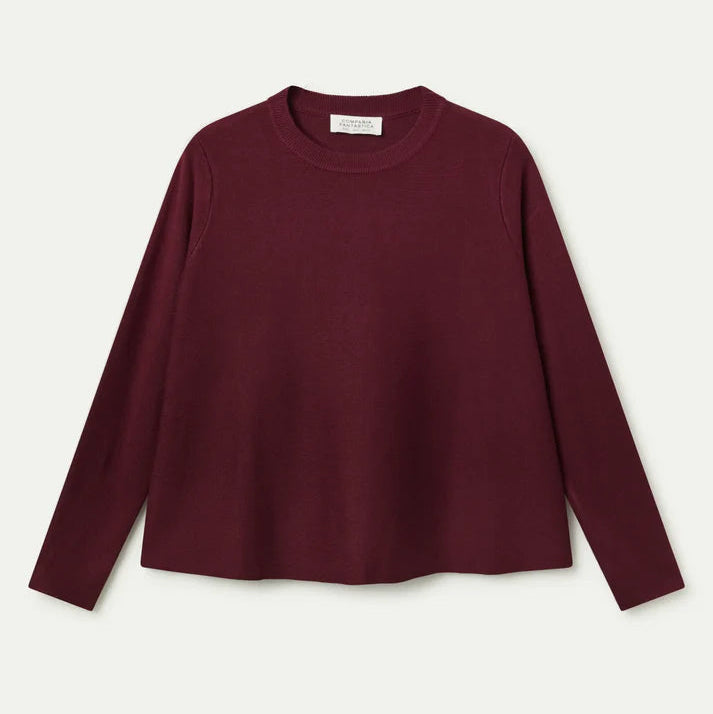 Maroon sweater on a light beige background