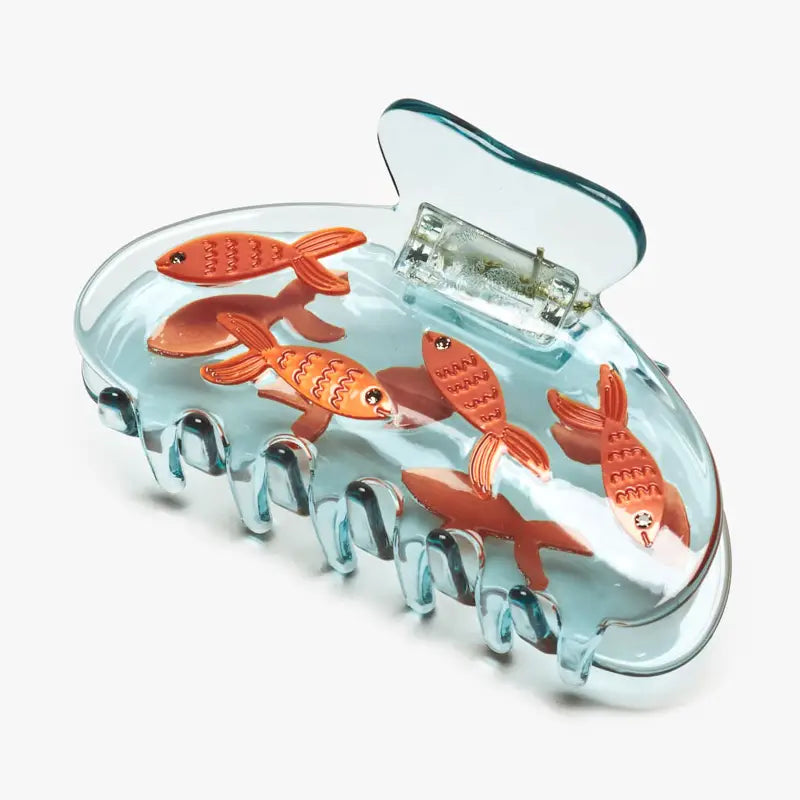 Clear hair clip with goldfish design on a white background