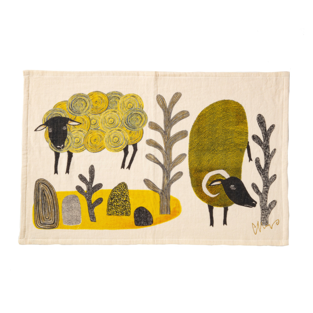 Tea towel with yellow sheep design
