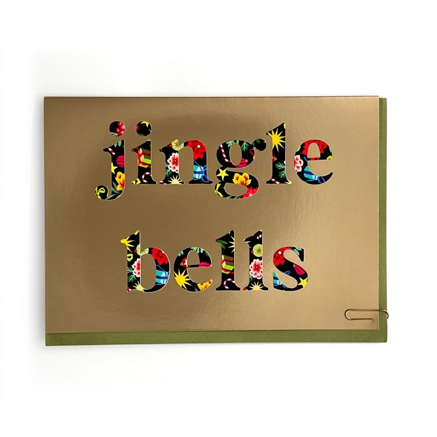 A square metallic gold greeting card with the words 'jingle bells' cut out in a colorful floral pattern, shown on a clean white background.
