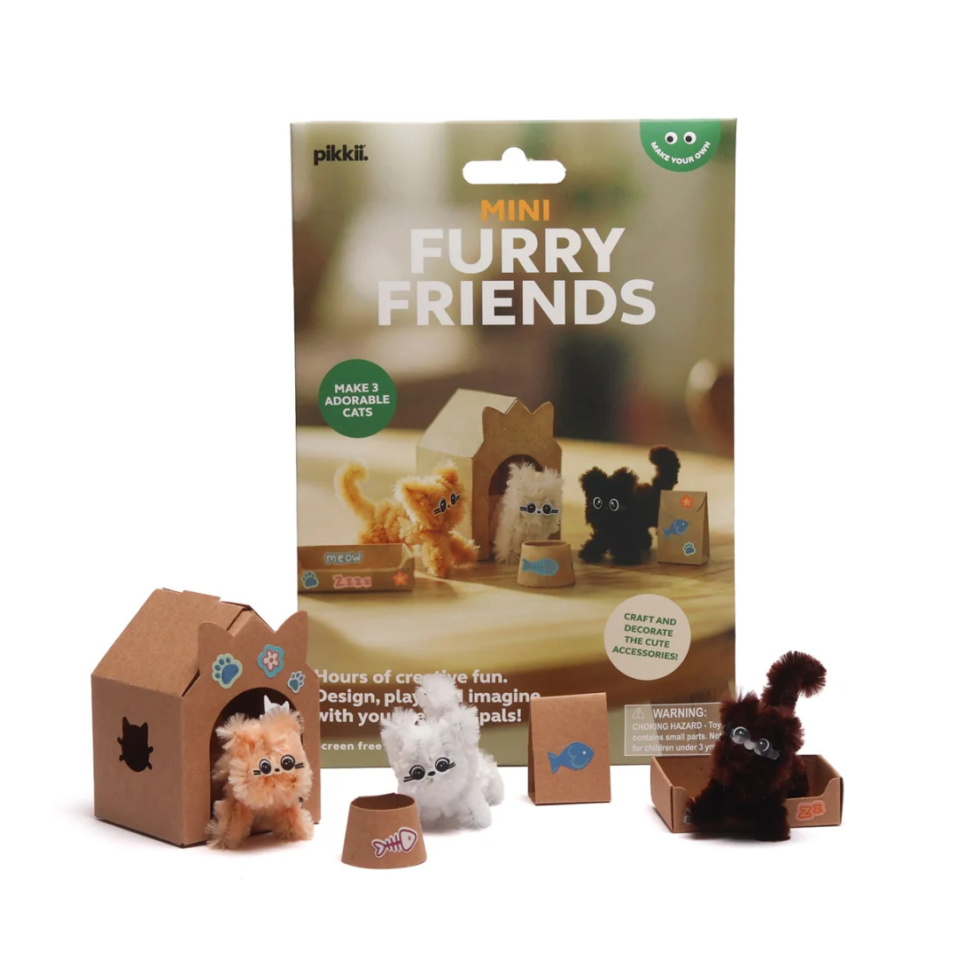 Pikki Mini Furry Friends craft kit with its retail packaging box, showing several small plush toy cats and cardboard house play-cats arranged in front of the box on a white background.
