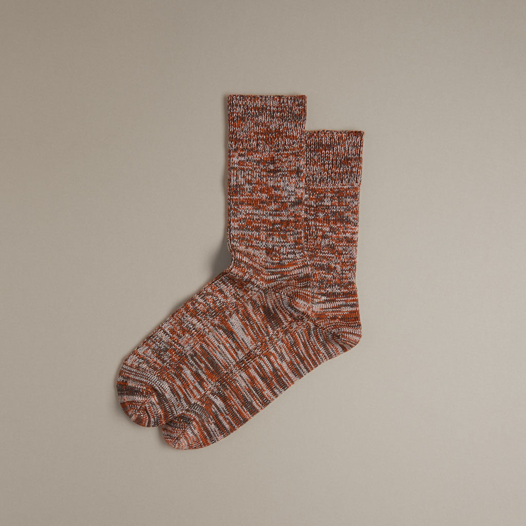 Pair of orange and gray speckled crew socks.