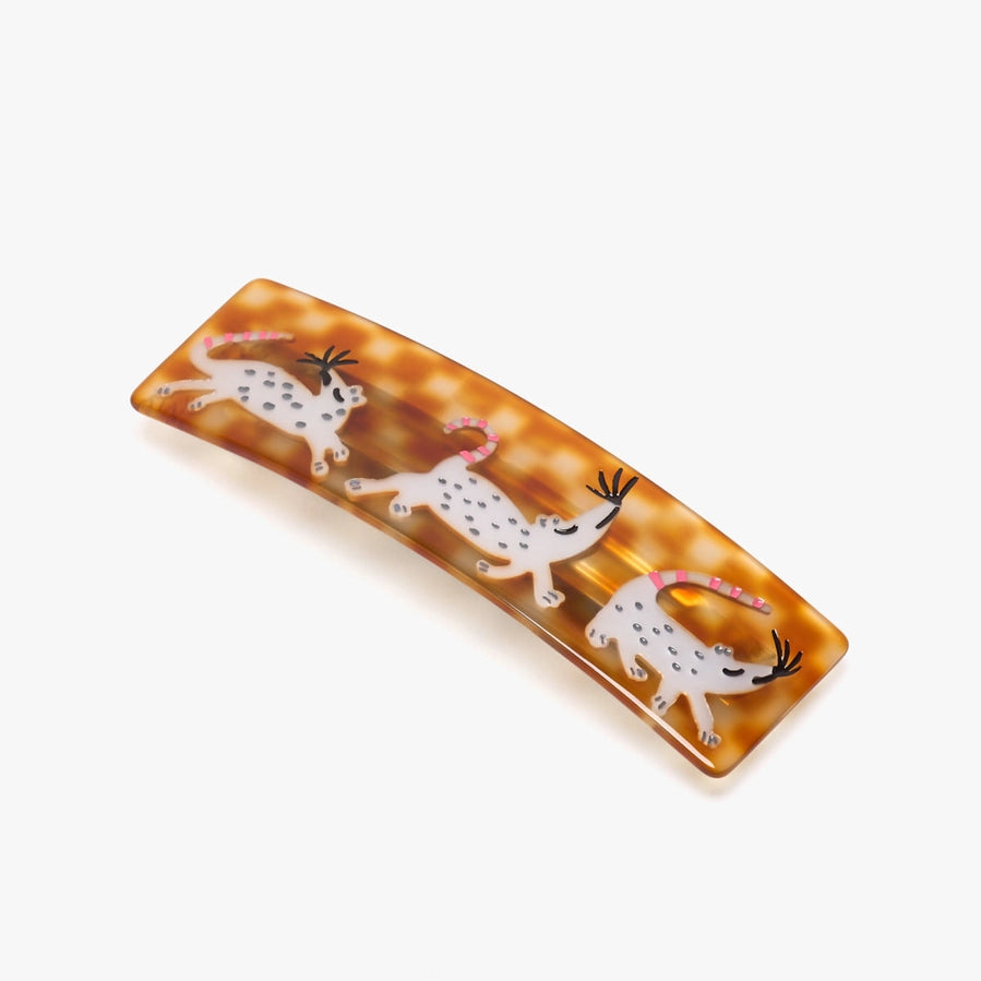 Rectangular tray with tortoiseshell pattern and white animal illustrations on a white background