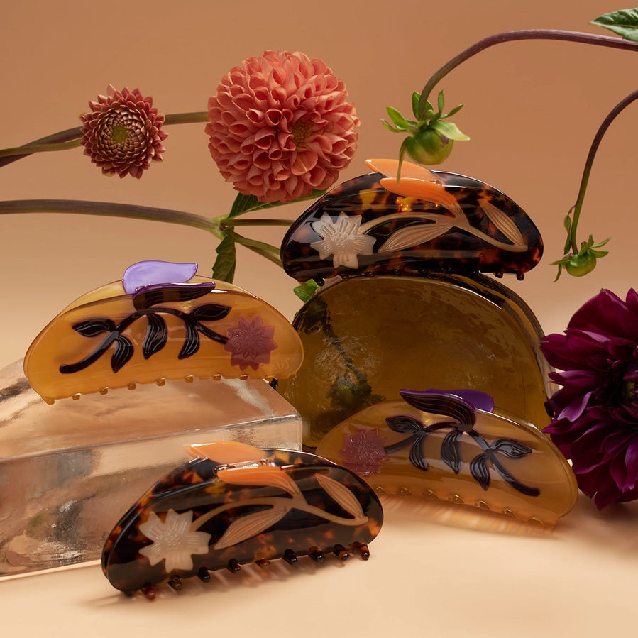Set of floral-patterned hair clips with flowers on a beige background