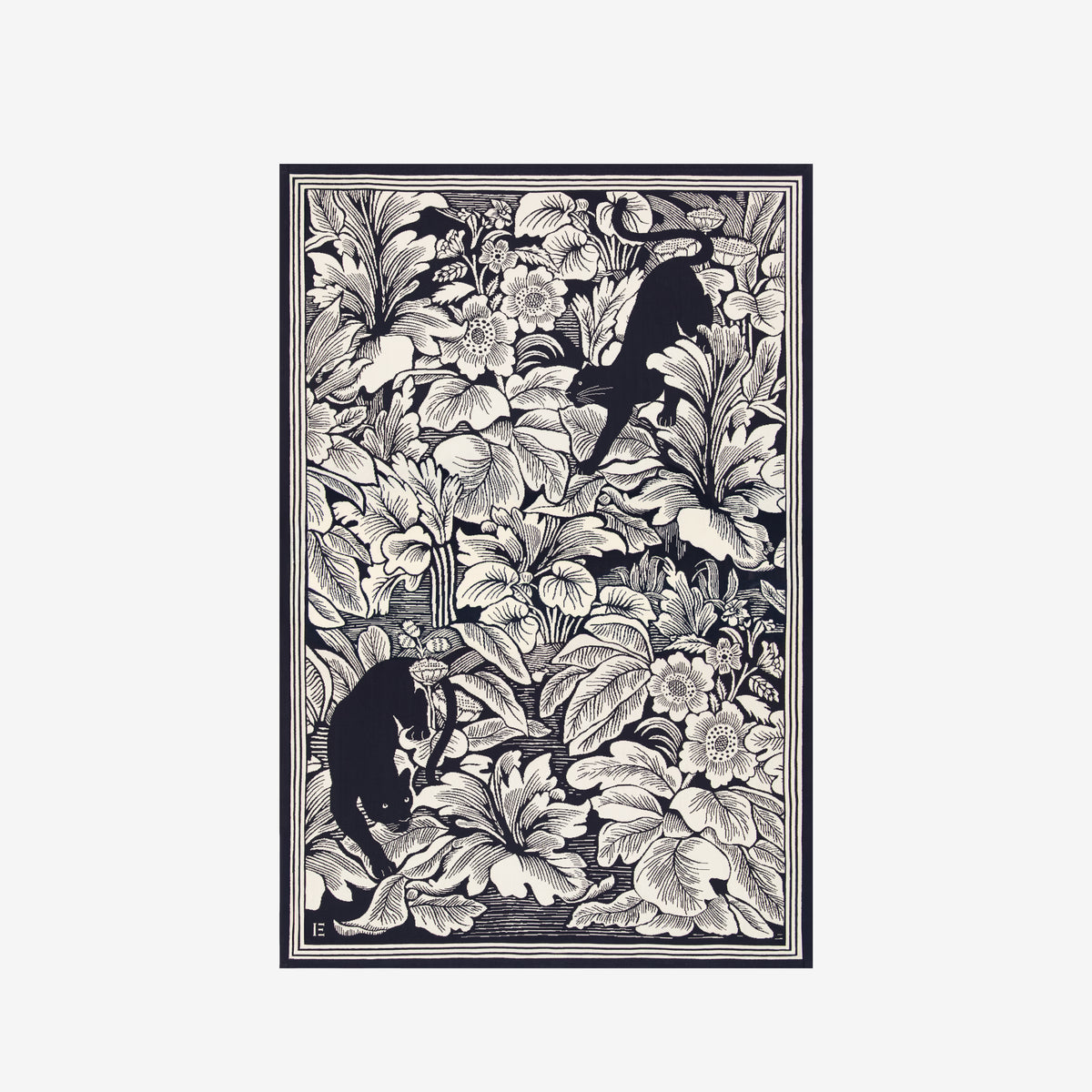 A framed black and white art print featuring a dense floral illustration with two black cats among the leaves, shown against a light gray background.