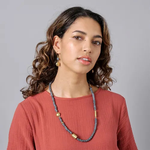 Gray beaded necklace with gold accents.