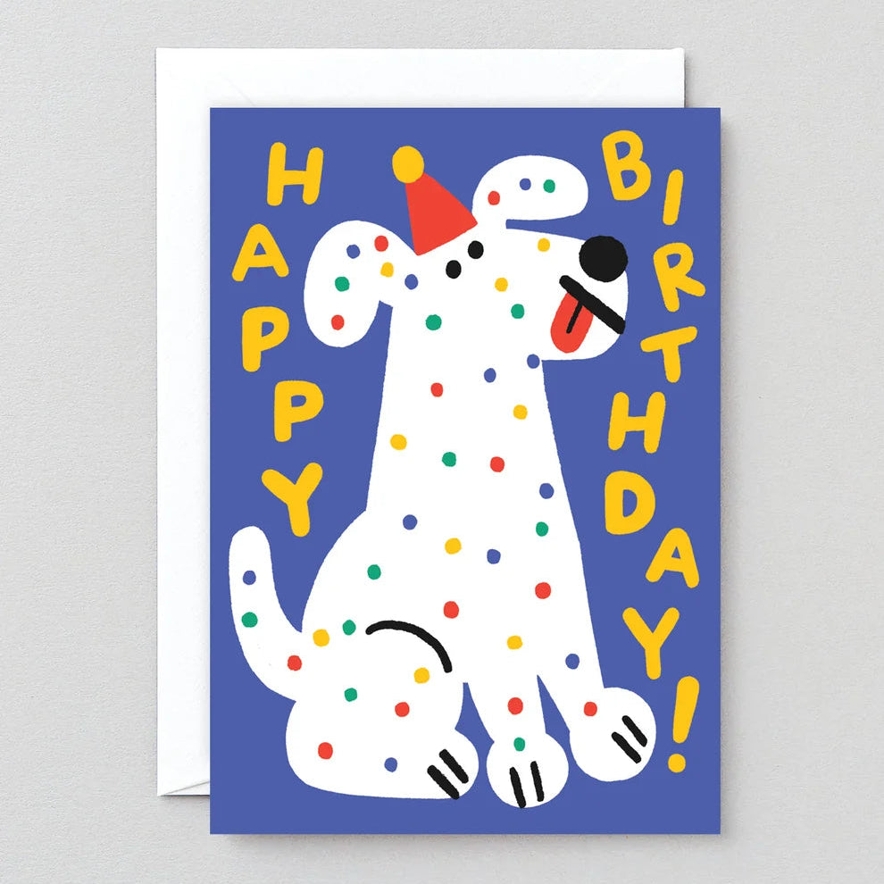 Birthday card with a cartoon dog and colorful text on a blue background