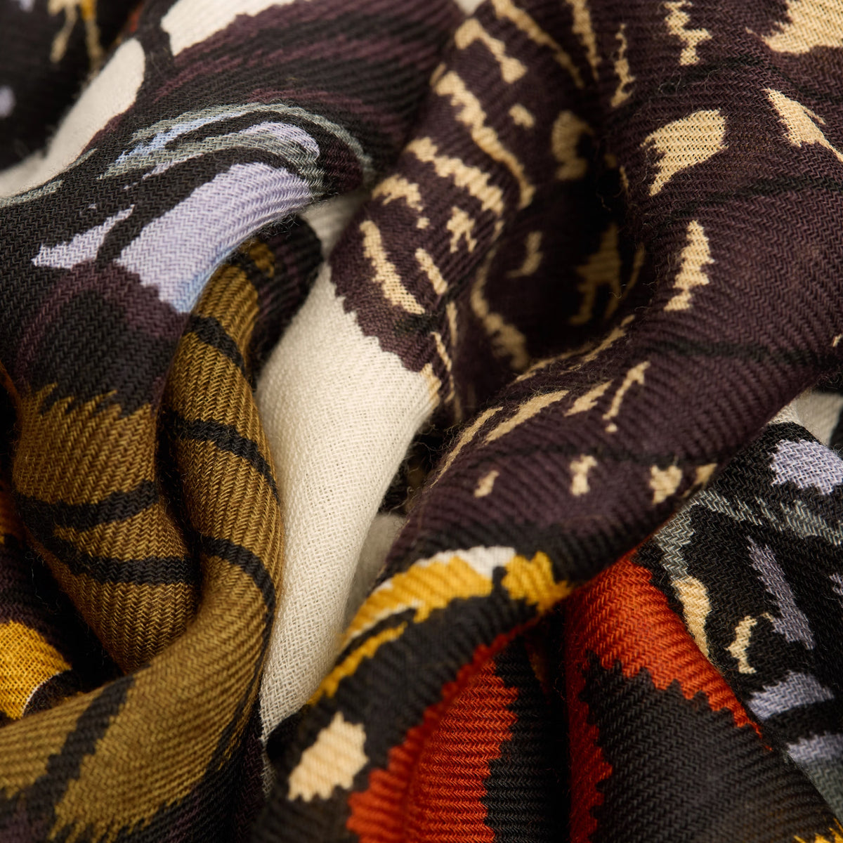 Close-up of patterned fabric with various colors and designs.