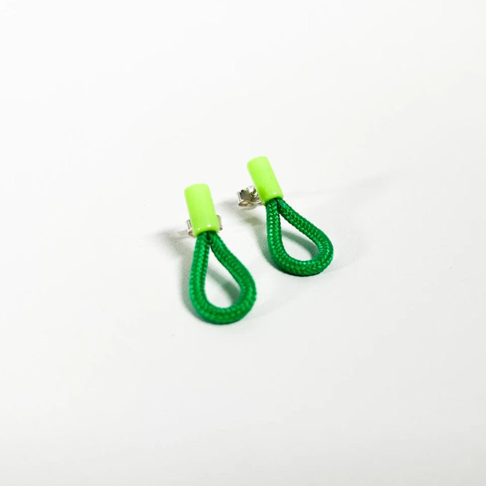 Green earrings with a white background