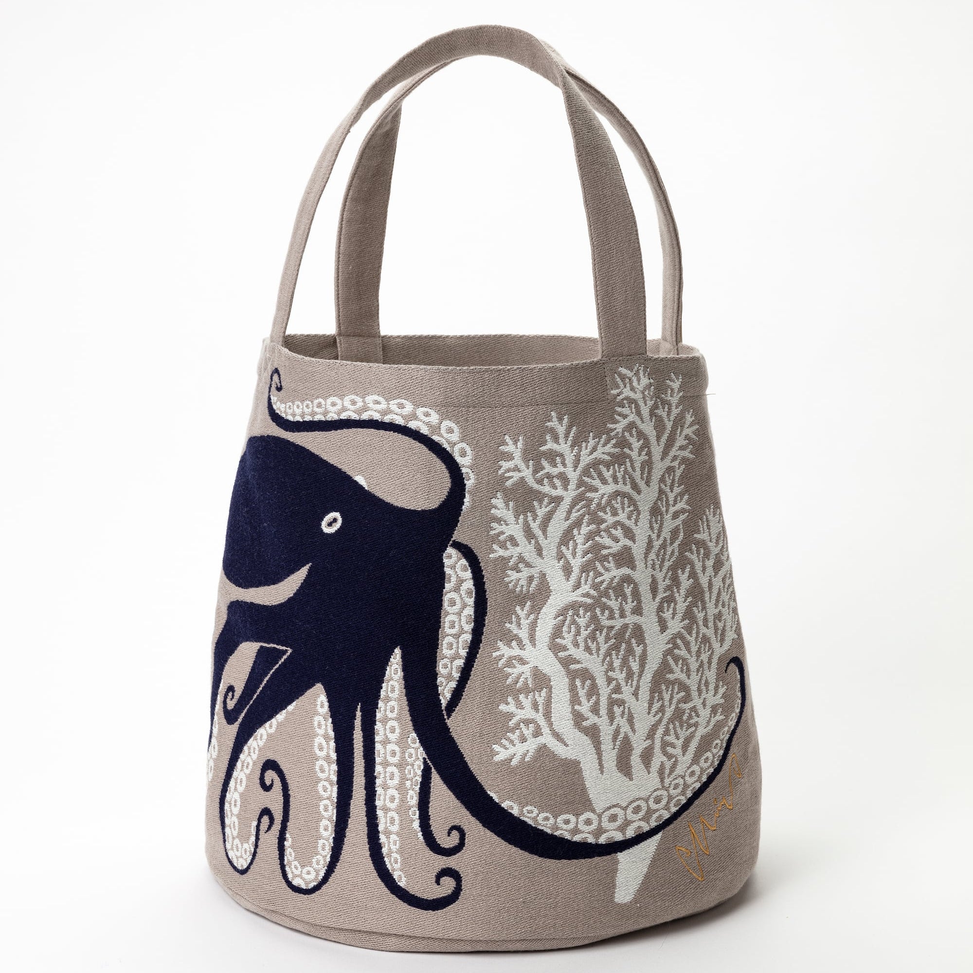 Tote bag with octopus design on a beige background