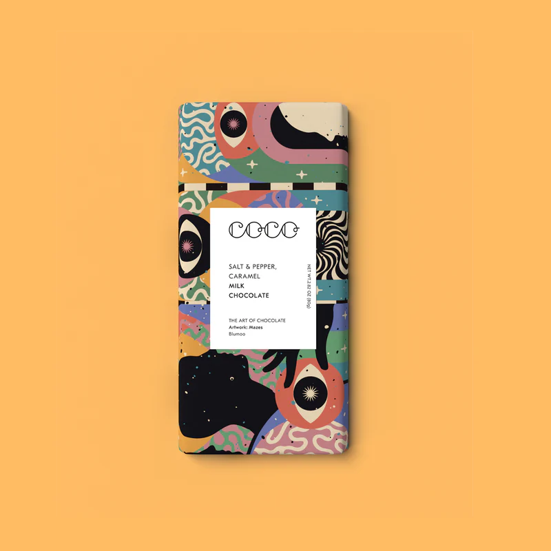 Milk chocolate bar with salt, pepper, and caramel; colorful abstract artwork on packaging.