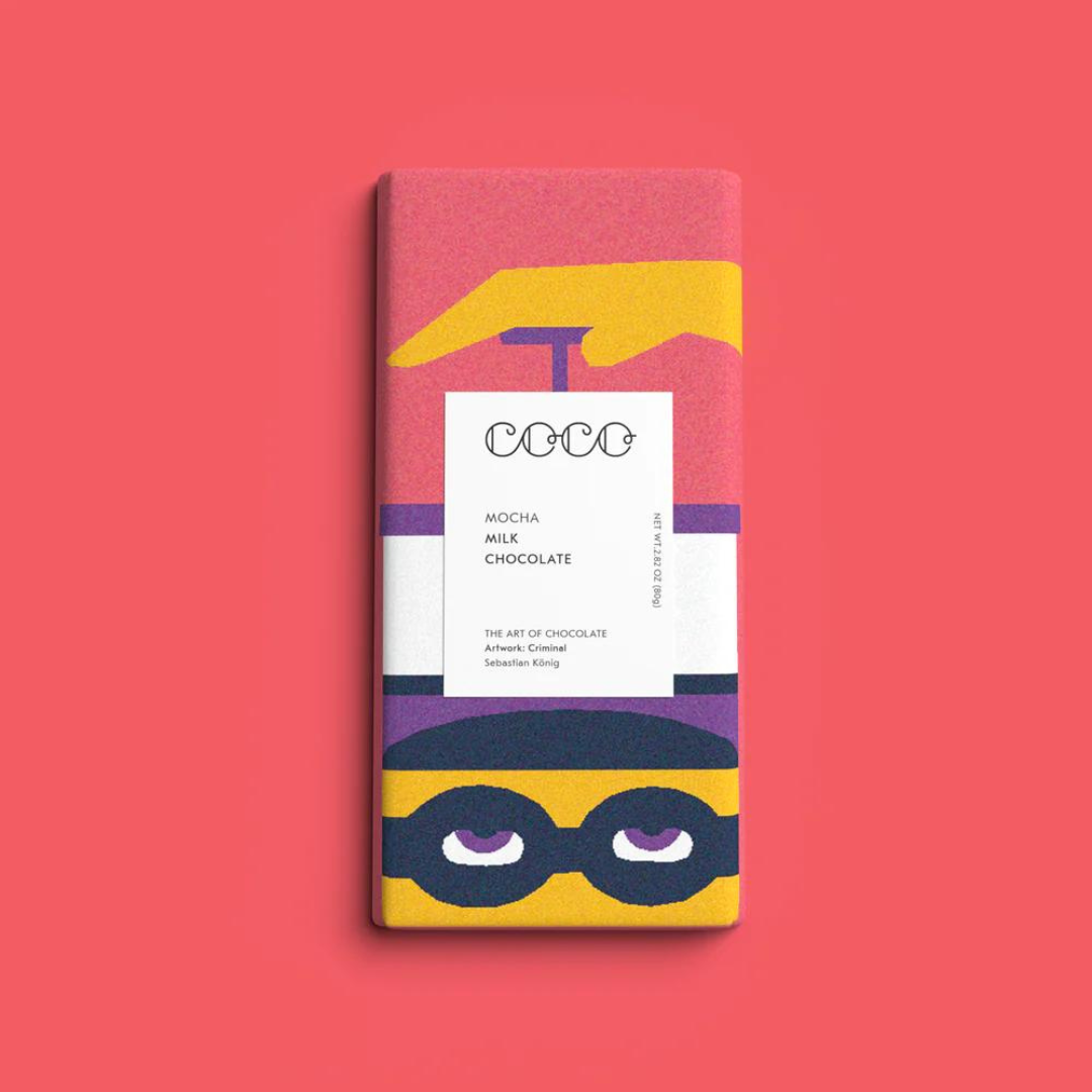 Mocha milk chocolate bar with illustrated packaging featuring a stylized hand and masked figure.