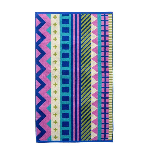 Colorful patterned towel with geometric designs on a white background